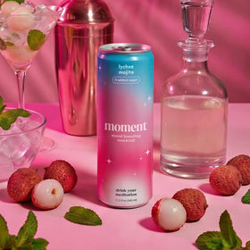 Moment Lychee Mojito label highlighting hibiscus, mint notes, and botanical wellness storytelling.