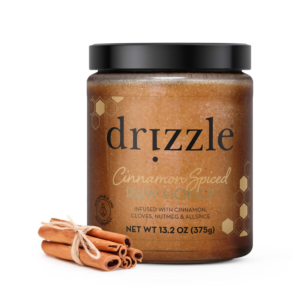 Drizzle Cinnamon Spiced Raw Honey bottle pour shows warm spice aroma ideal for tea.