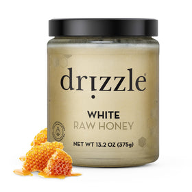 Drizzle White Raw Honey jar front view shows creamy texture