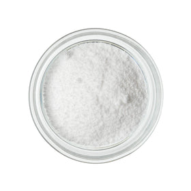 Druids Grove Lactic Acid Powder poured into liquid for easy dissolution.