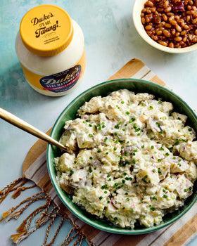 Spread Duke's mayo on a sandwich for creamy tang.