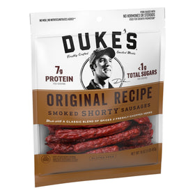 Duke's Original Recipe spice blend close-up, highlighting herbs and roasted garlic aroma.