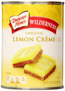 Duncan Hines Wilderness Lemon Crème Pie Filling jar being poured, ideal for quick desserts.