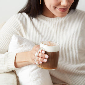 Dunkin' Donuts decaf K-Cup pod in cup with a smooth, inviting brew.