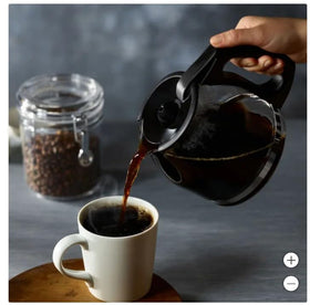 Open bag of Dunkin' Donuts Original Blend reveals fresh aroma for home use.
