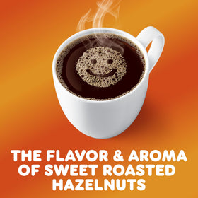 Close-up of Dunkin Hazelnut coffee bags highlighting medium roast flavor
