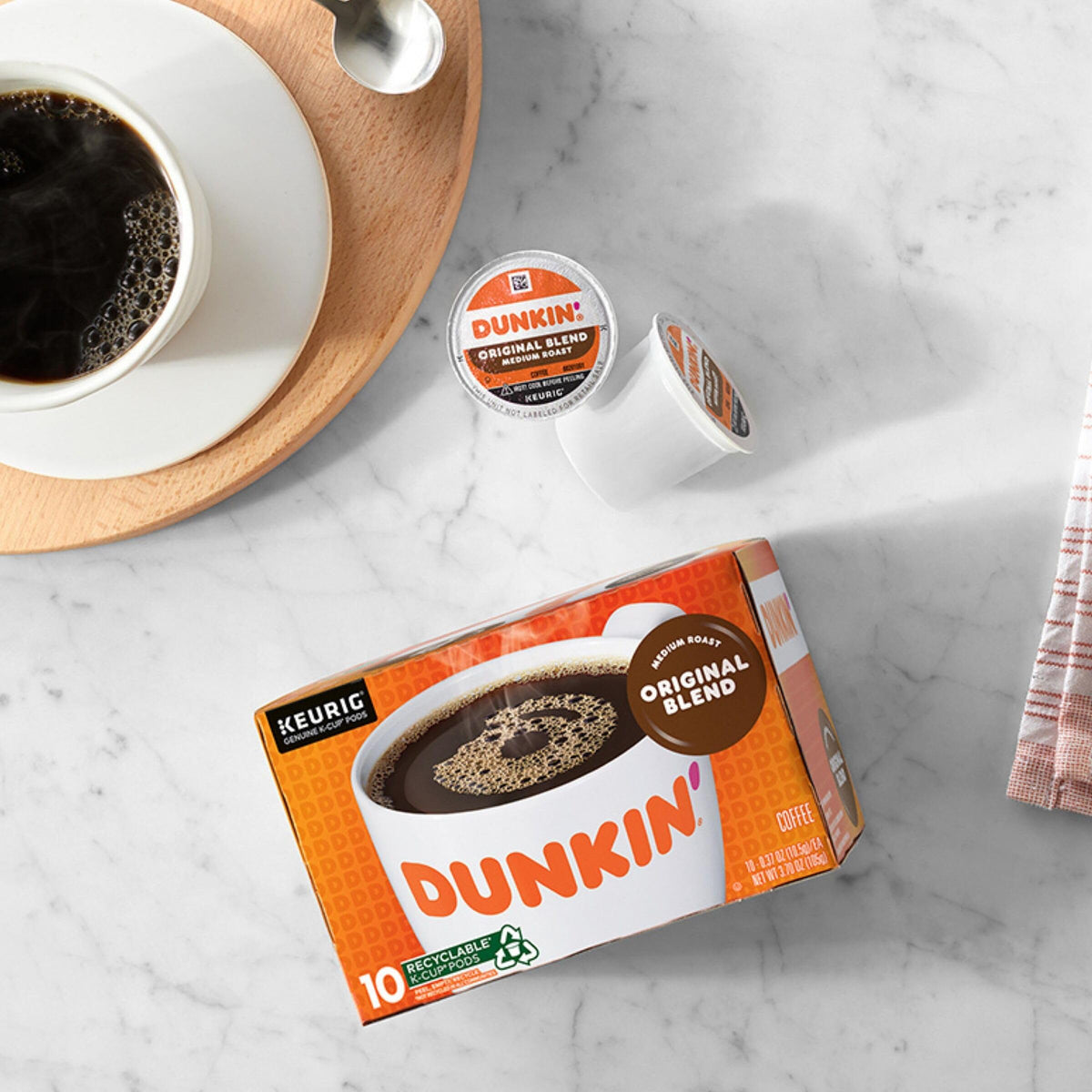 Fresh Dunkin Original Blend cup with visible steam signaling a comforting start.