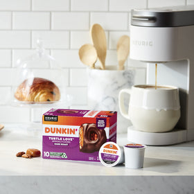 Dunkin Turtle Love brewed coffee in a cup showcasing aroma and color