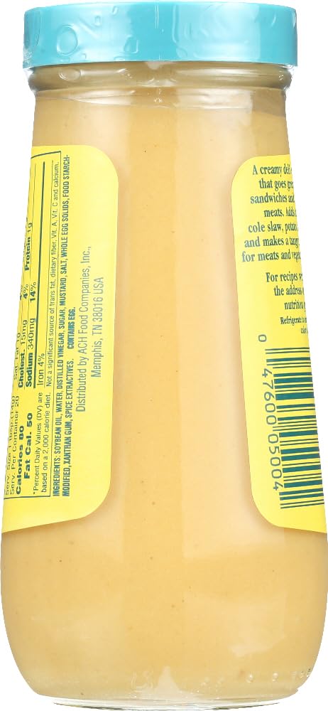 Durkee Salad Sauce bottle atop a fresh salad for zesty dressing without heavy cream.