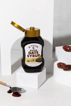 D'Vash Organics date syrup pouring on pancakes for natural topping