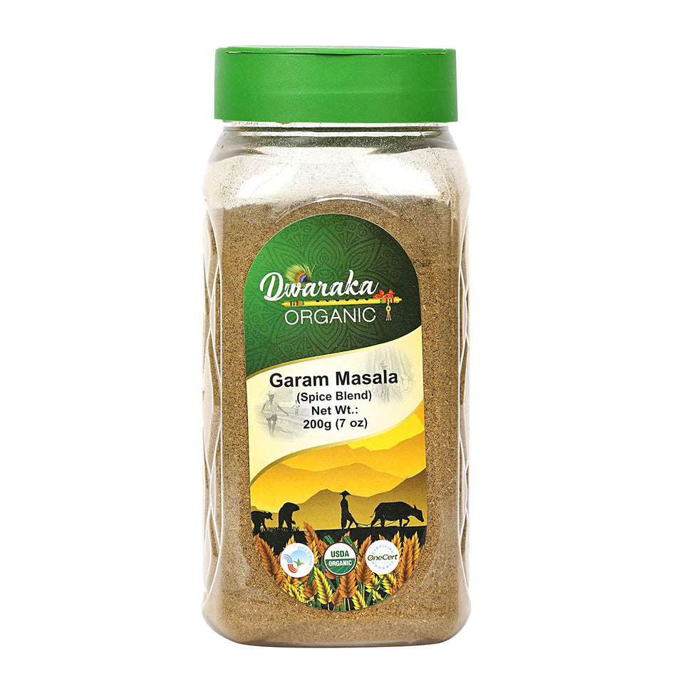 Dwaraka Organic Garam Masala powder in a jar, perfect for flavorful curries.
