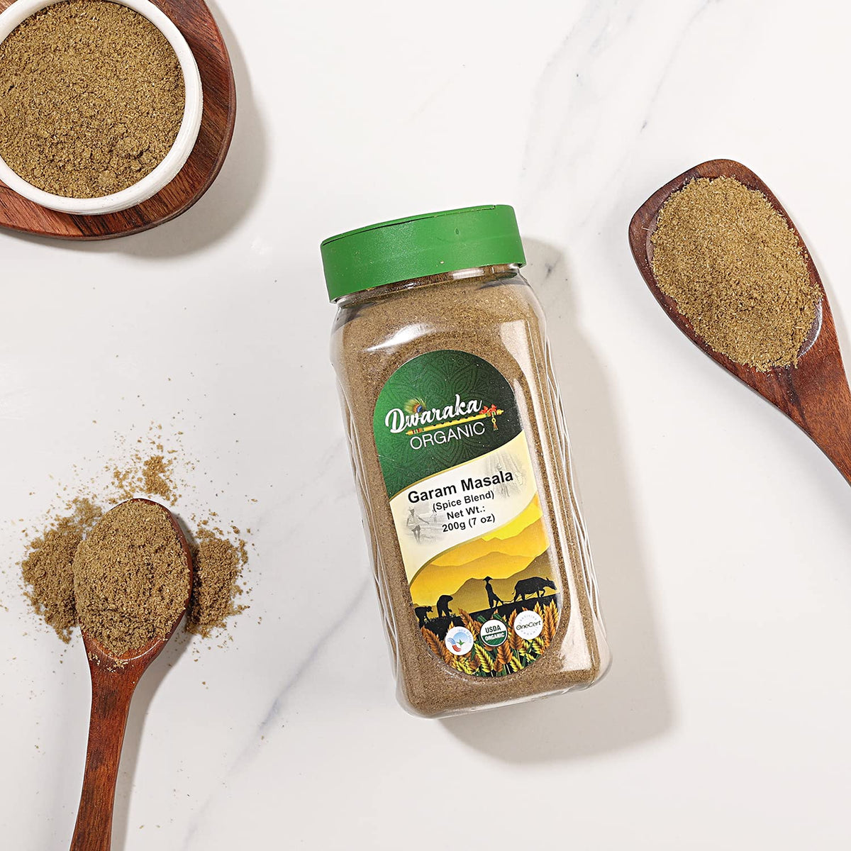 Dwaraka Garam Masala sprinkled on a dish to enhance flavor.