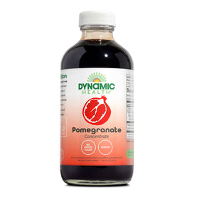 Dynamic Health Pomegranate Juice Concentrate bottle on the counter highlighting organic ingredients.