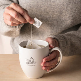 Earth Mama third-trimester tea ingredients nettle chamomile visible for a mineral-rich blend.