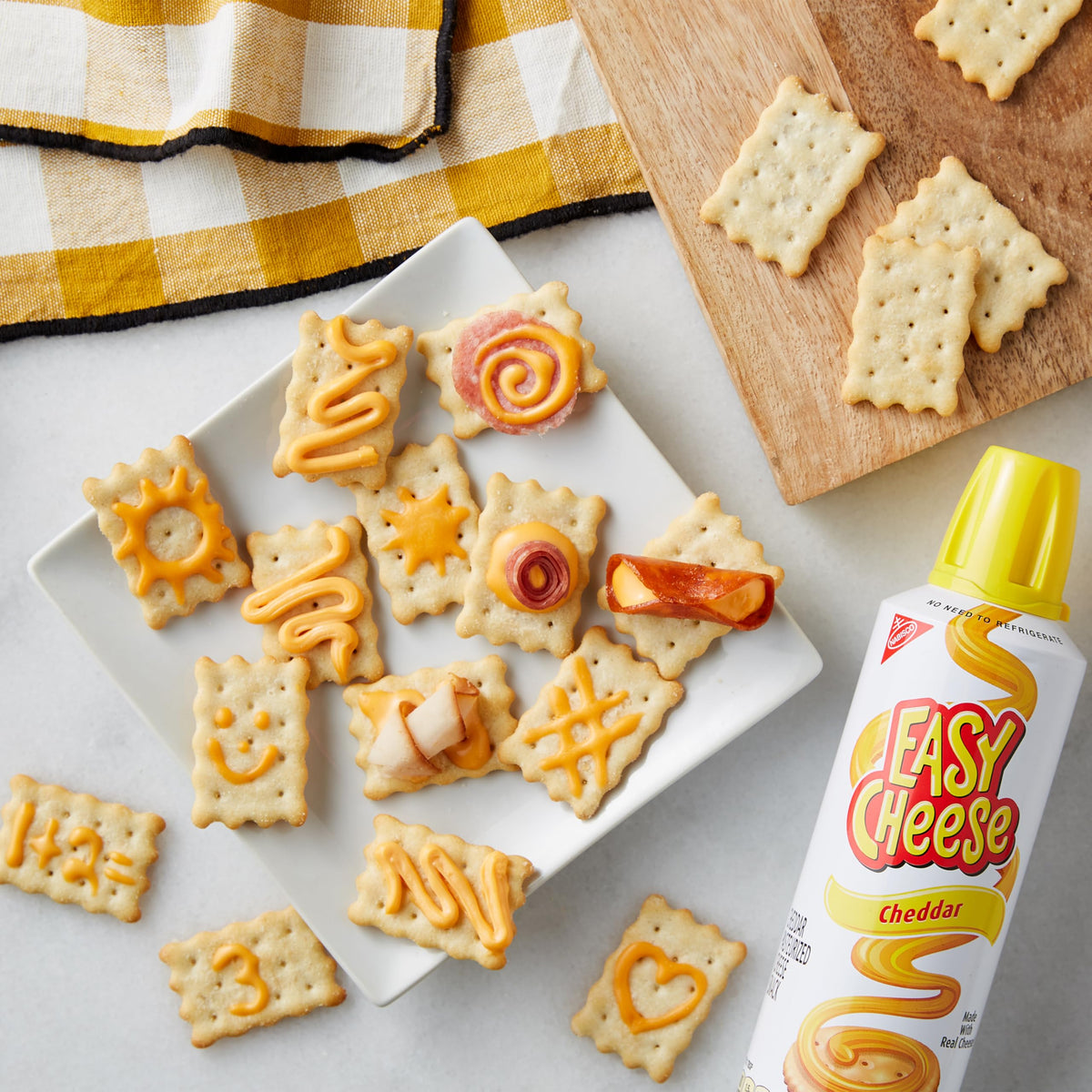 EASY CHEESE cheddar spray close-up showing creamy texture.