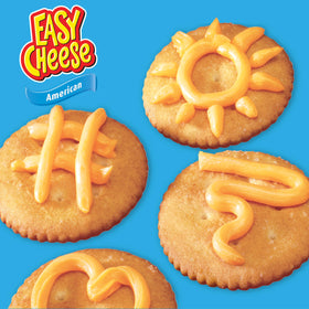 Easy Cheese being dispensed onto a cracker to spark snack ideas.