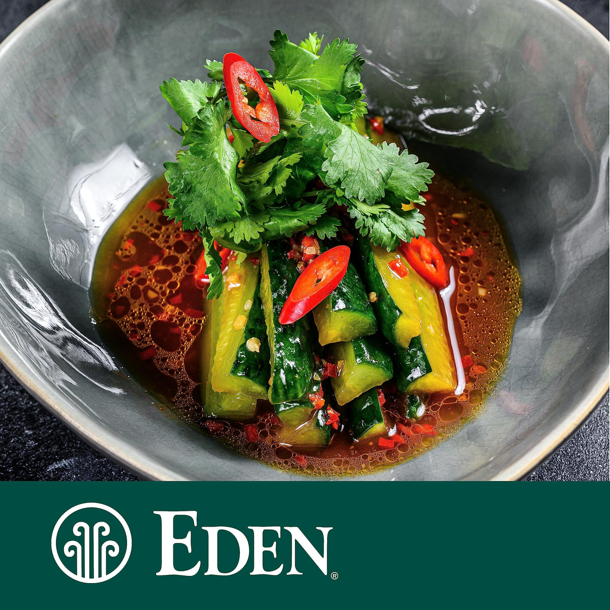 Eden Black Sesame Oil with salad imagery hints dressing versatility