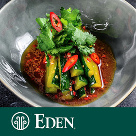 Eden Black Sesame Oil with salad imagery hints dressing versatility