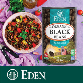 Cooked Eden Black Beans dish with tomatoes suggesting chunky salsa and hearty sides.