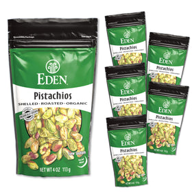 Eden Organic Pistachios closeup shows salt grains on lightly roasted nuts.