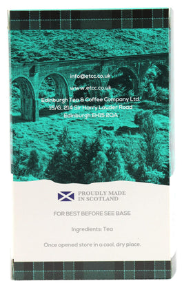 Cup pouring Edinburgh Scottish Breakfast Tea showing rich aroma and bold flavor.