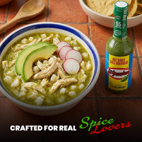 El Yucateco Green Habanero swirl in sauce dish hints at authentic Mexican flavor.