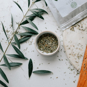 Elanen Naturals Organic Olive Leaf Tea traditional use shown in Mediterranean rituals.