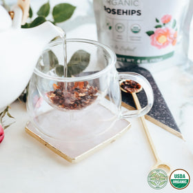 Elanen Naturals bulk rosehips in bowl, rich aroma inspiring cozy tea moments.