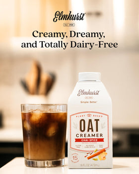 Elmhurst 1925 chai spice oat creamer in cafe latte preparation