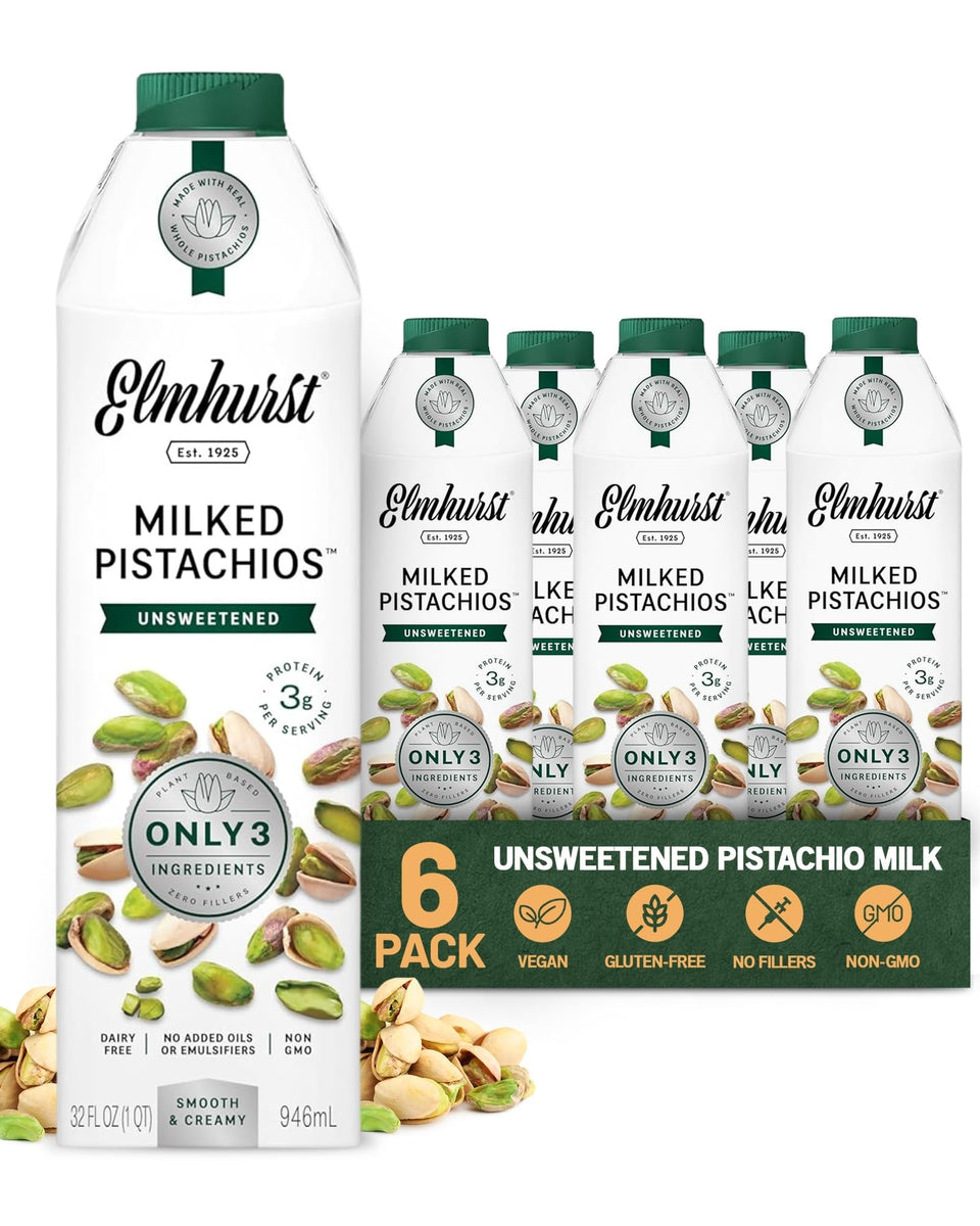 Elmhurst 1925 pistachio milk being poured into a glass, showcasing creamy texture