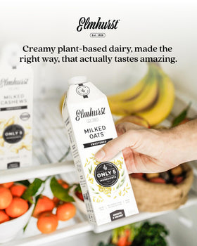 Shelf-stable Elmhurst oat milk on pantry shelf for easy mornings.