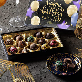 Empire Delights milk-shell truffle close-up, creamy texture and smooth melt.