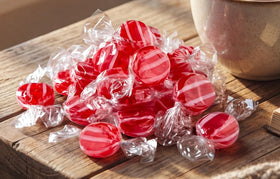 EMPORIUM CANDY classic red and white striped discs for holiday buffets.