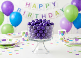 Emporium Candy purple gumballs arranged for a party display