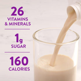 Pouring Ensure Max Protein Shake into a glass for quick energy.