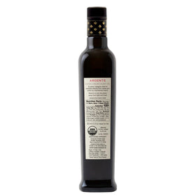 Entimio Ardente olive oil pouring scene highlighting premium bottle design