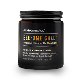 Enviromedica Bee-Ome Gold bottle with pour, highlighting probiotic-rich honey for daily wellness