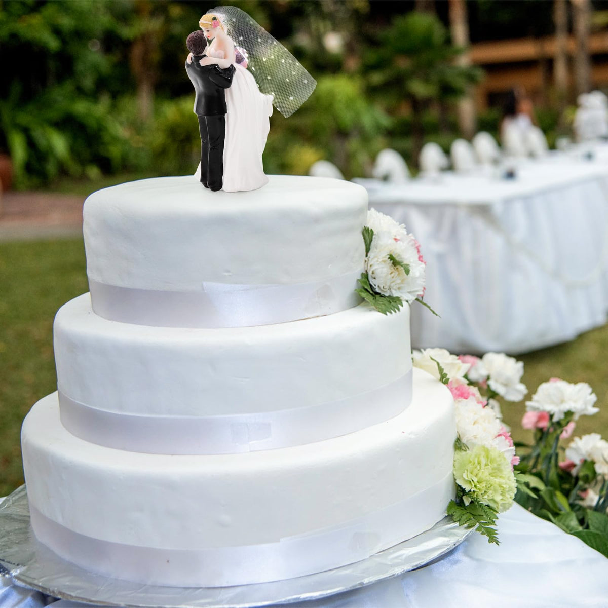 Eorbow wedding topper provides a durable resin keepsake for home display