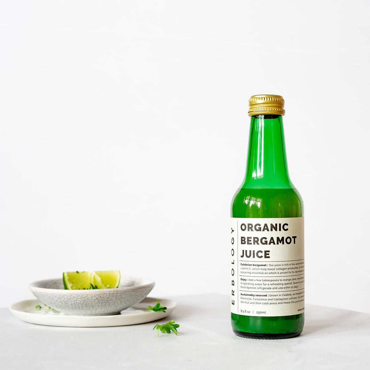 Erbology bergamot juice farm sunlight image signals small-batch processing.