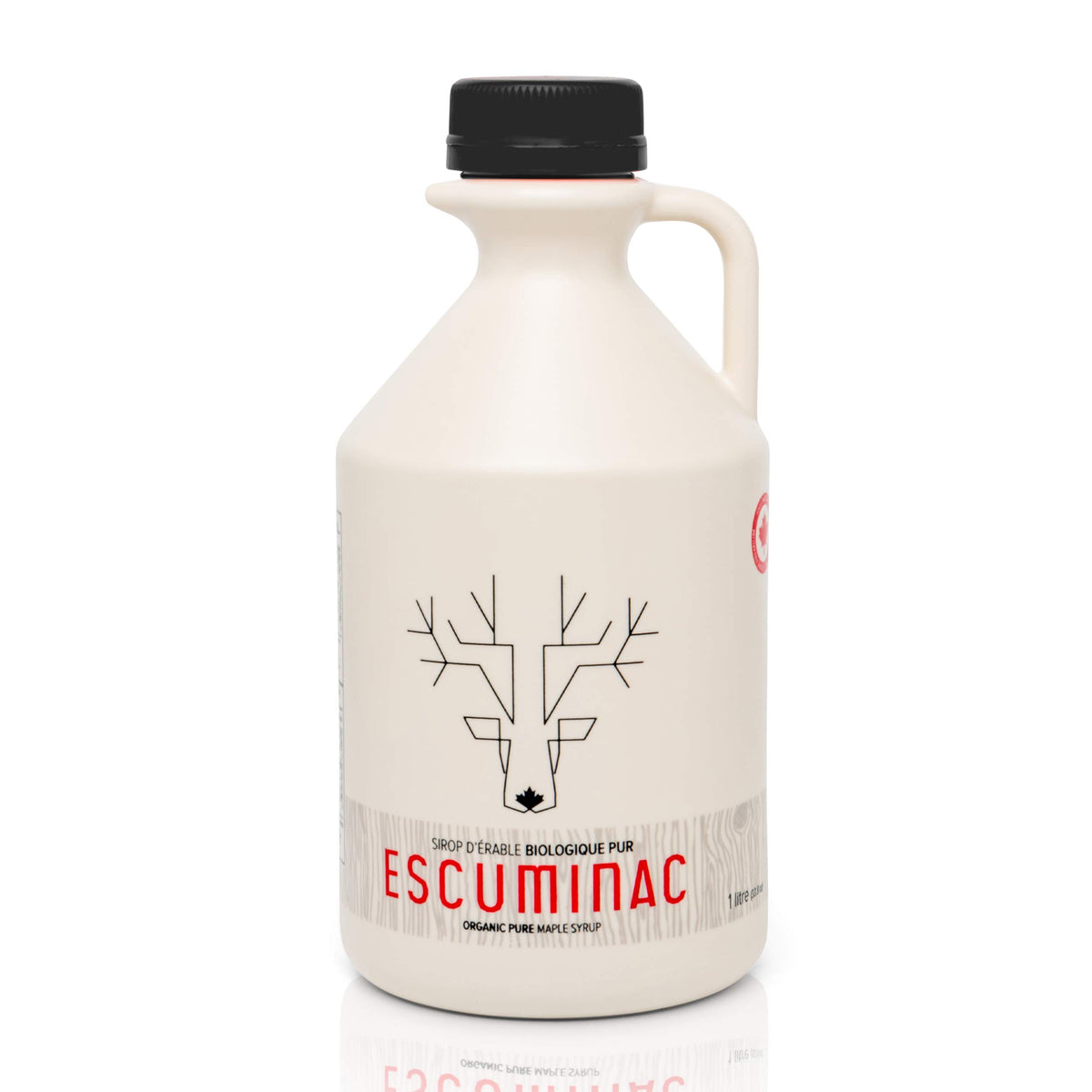 Escuminac maple syrup bottle drizzled over pancakes for breakfast sweetness.