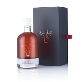 Escuminac maple syrup amber bottle showcasing premium organic flavor for pancakes and desserts.