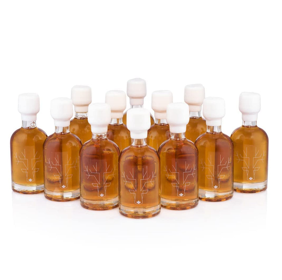 Escuminac maple syrup amber 50ml bottle pour, ideal for finishing desserts.