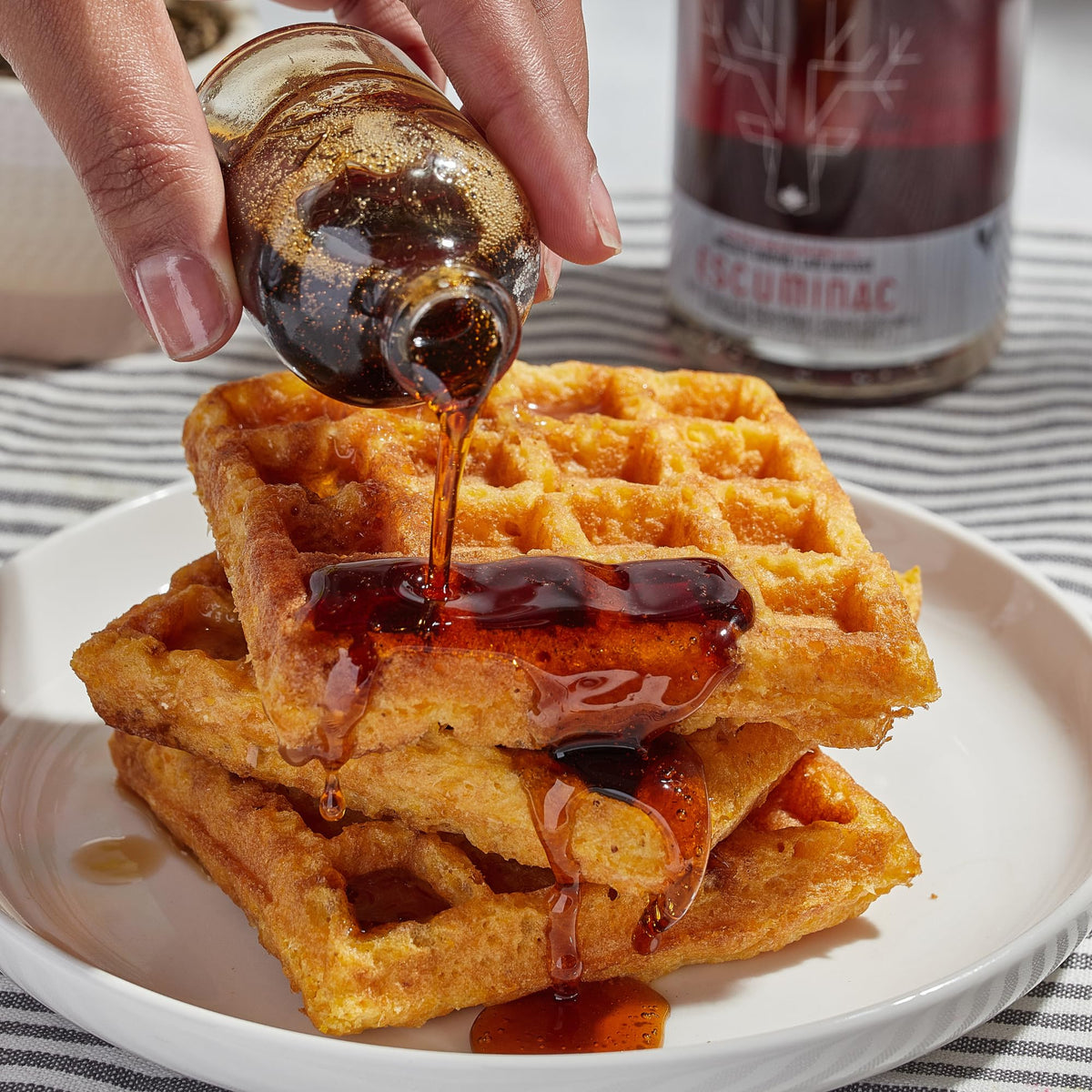 Escuminac premium glass bottle packaging elevates gifting and tableside presentation.