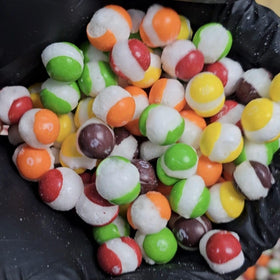 Texture closeup of EShopX Rainbow Candy showing airy brittle bite