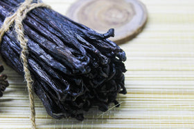 ESSENCE HOMEMADE VANILLA EXTRACT setup featuring Tahitian vanilla beans for infusion.