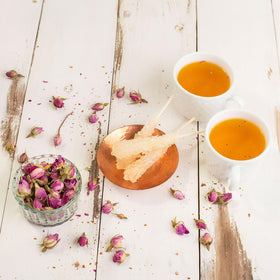 Eupherbia Rock Candy Sticks tea-pairing scene highlights melt-in sweetness for hot tea.