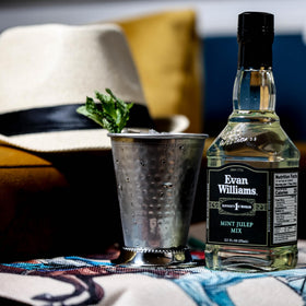 Evan Williams Mint Julep Mix being poured for a refreshing Kentucky bourbon cocktail.