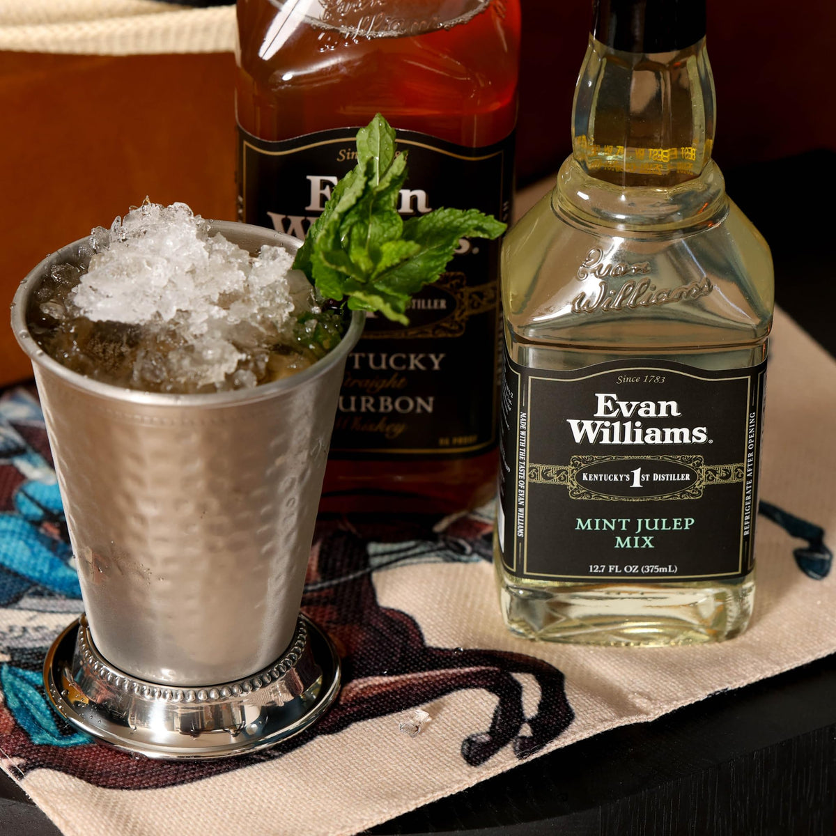 Evan Williams Mint Julep Mix served with mint garnish for Derby-ready cocktails.