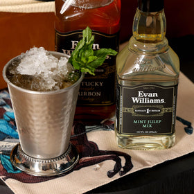 Evan Williams Mint Julep Mix served with mint garnish for Derby-ready cocktails.