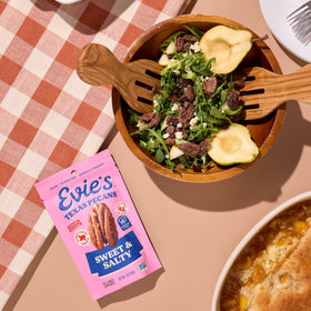 Evie's pecans packaging display highlights four flavors for quick selection.